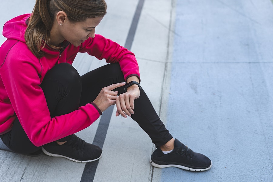 girl using a fitness tracker