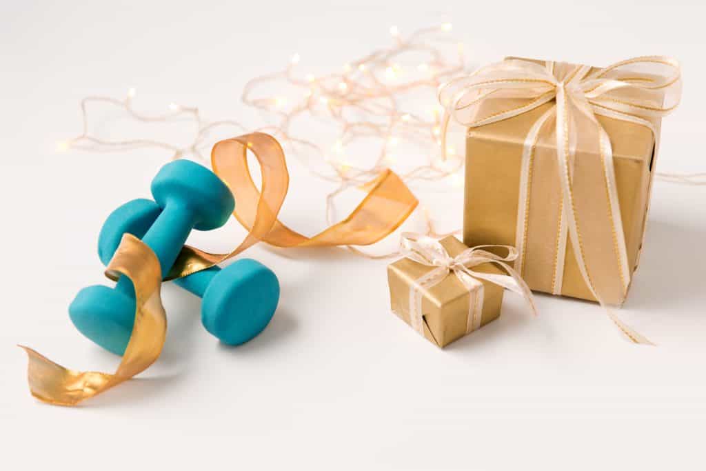 presents and blue dumbbells gifts for fitness lovers