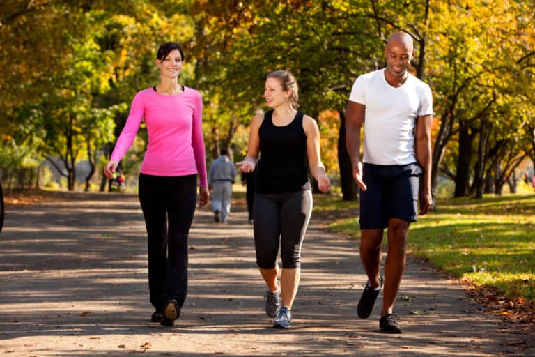 people walking outside - how to burn more calories while walking