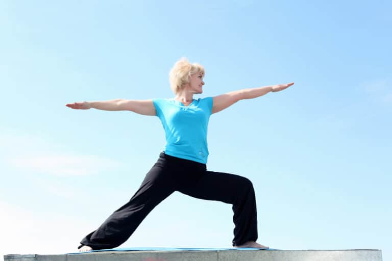 Portrait of a senior woman doing yoga outdoors