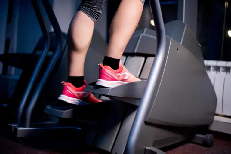 woman on a stair climber machine - what muscles does a stairmaster work?