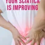 man holding his back with text overlay signs of sciatica improving