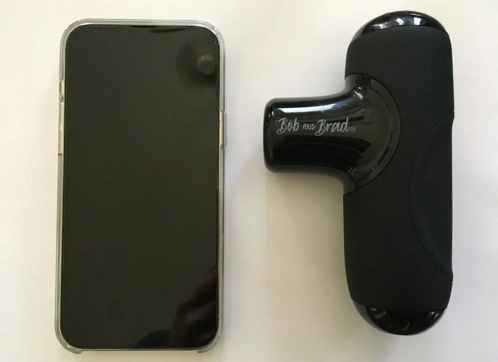 size comparison of the bob and brad q2 mini next to iphone - bob and brad q2 mini massage gun review